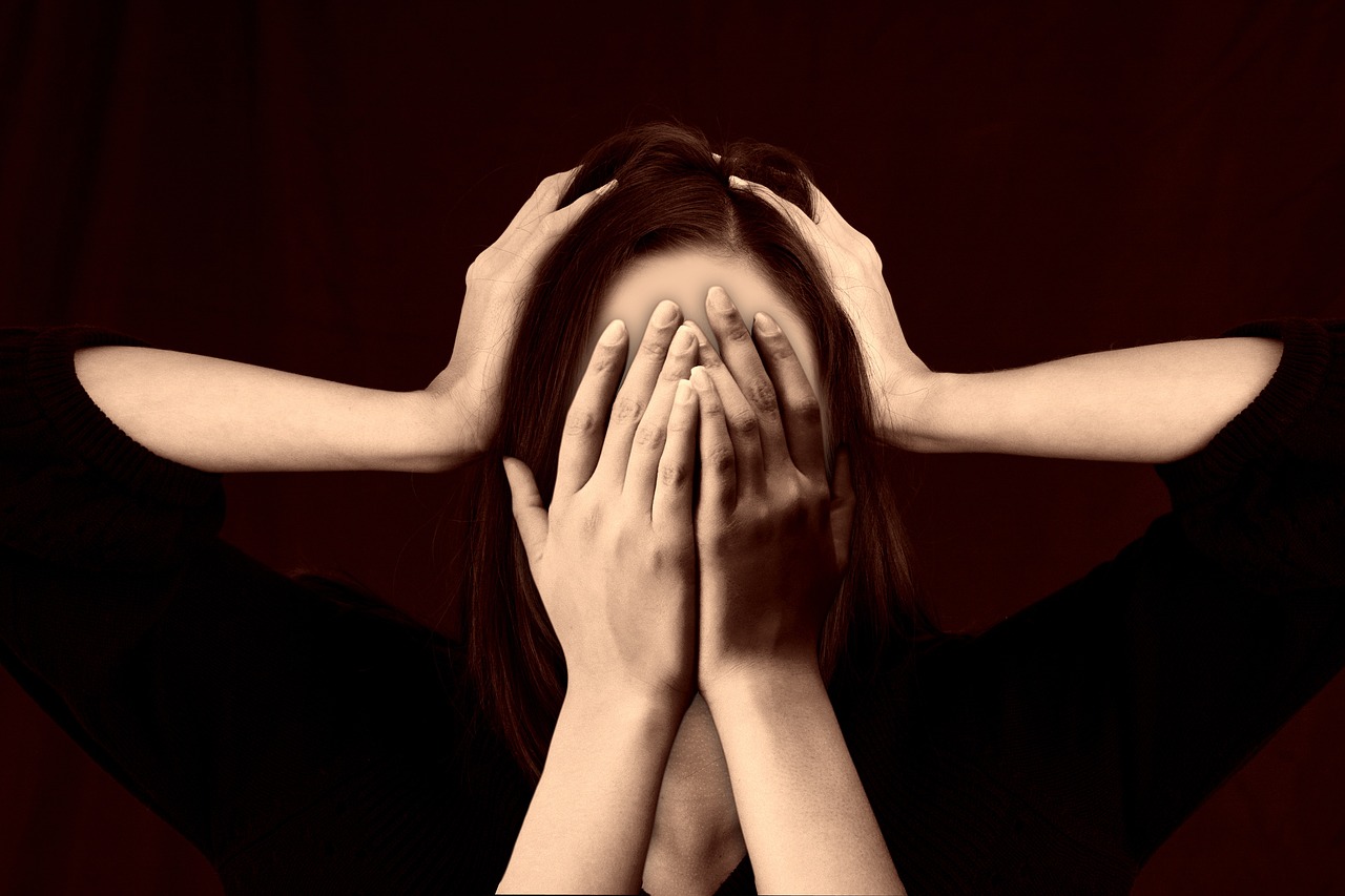 Anxiety treatment in Mumbai - woman covering face with hands showing stress and anxiety symptoms